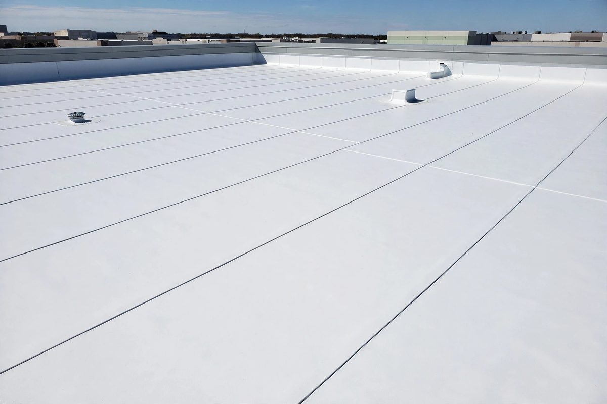 New white membrane commercial roof installed by roofing companies near me that finance